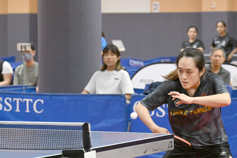 Facing a strong opponent, our colleague stayed fully focused, fighting for every point.